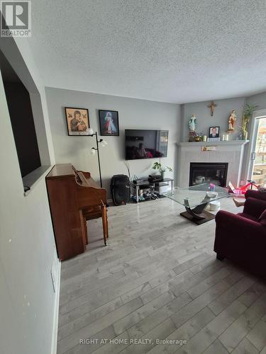 family room with fireplace - 85 Margrave Avenue, Ottawa, ON - Indoor With Fireplace