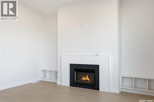 151 Nazarali Way, Saskatoon, SK - Indoor Photo Showing Living Room With Fireplace