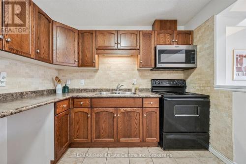 93 Washburn Drive, Guelph (Grange Road), ON - Indoor Photo Showing Kitchen With Double Sink