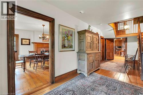 Corridor featuring light wood-style flooring and suspended lighting - 2432 Seburn Road, Fonthill, ON - Indoor Photo Showing Other Room