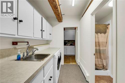 Laundry area featuring a baseboard heating unit and a sink - 2432 Seburn Road, Fonthill, ON - Indoor Photo Showing Kitchen