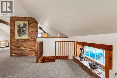 Bonus room featuring plenty of natural light, lofted ceiling with beams, carpet flooring, and baseboard heating - 2432 Seburn Road, Fonthill, ON - Indoor Photo Showing Other Room