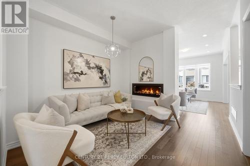 32 Mountainside Crescent, Whitby, ON - Indoor Photo Showing Living Room With Fireplace
