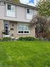 Lovely semi-detached featuring a brick and siding exterior, front lawn, mature tree, and landscaped garden bed - 1345 Colonsay Drive, Burlington, ON  - Outdoor 