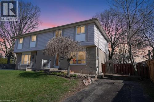 Traditional-style house featuring porch, brick and siding - 1345 Colonsay Drive, Burlington, ON - Outdoor