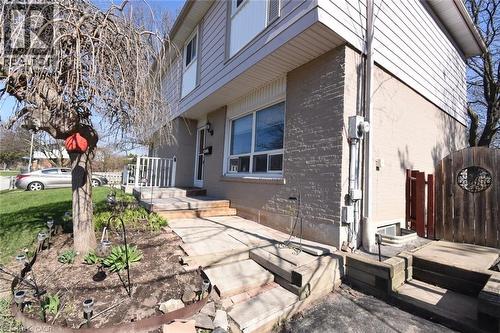 Home's exterior with brick, siding and a garden - 1345 Colonsay Drive, Burlington, ON - Outdoor