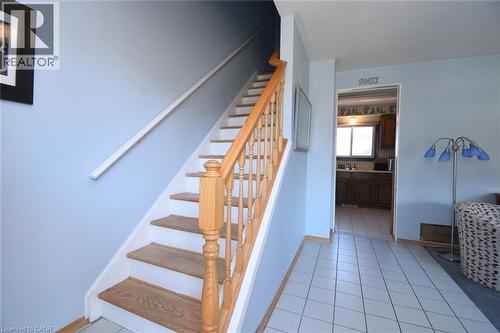 Beautiful hardwood Stairway off the tiled floor foyer and hall - 1345 Colonsay Drive, Burlington, ON - Indoor Photo Showing Other Room