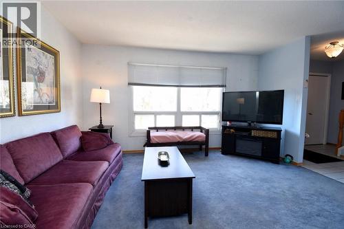 Living area featuring carpet flooring and plenty of natural sunlight - 1345 Colonsay Drive, Burlington, ON - Indoor Photo Showing Living Room