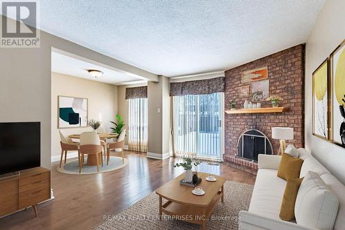 This is Virtually Staged for visual effect - 3016 Rymal Road, Mississauga, ON - Indoor Photo Showing Living Room With Fireplace