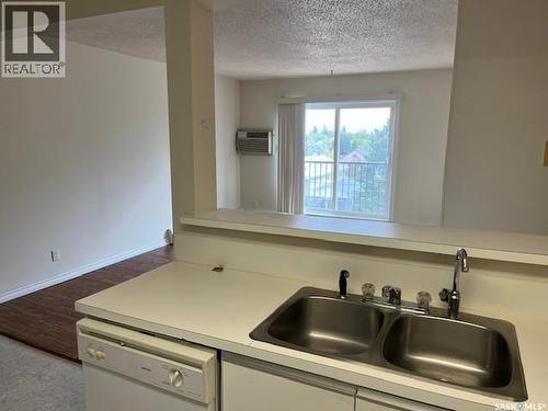 302 8Th Avenue Sw, Biggar, SK - Indoor Photo Showing Kitchen With Double Sink