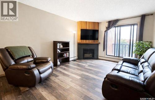 308 1140 9Th Avenue Ne, Swift Current, SK - Indoor Photo Showing Living Room With Fireplace