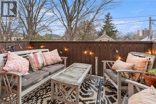 Wooden deck with an outdoor lounge area - 58 Hohner Avenue, Kitchener, ON - Outdoor