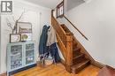 Stairway with hardwood / wood-style floors and ornamental molding - 58 Hohner Avenue, Kitchener, ON  - Indoor Photo Showing Other Room 