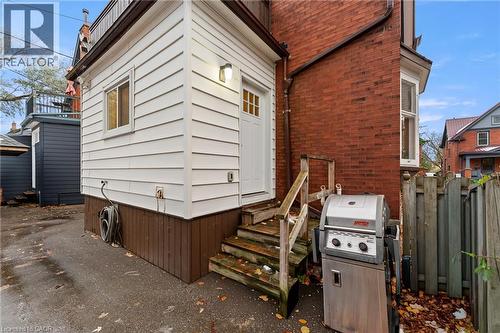 View of side of home featuring brick siding and entry steps - 58 Hohner Avenue, Kitchener, ON - Outdoor With Exterior
