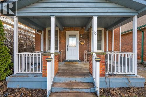 View of exterior entry with a porch and brick siding - 6 Ben Lomond Place, Hamilton, ON - Outdoor With Deck Patio Veranda