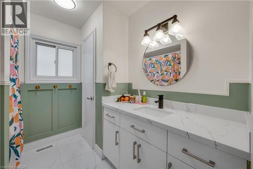 Full bath featuring vanity, light marble finish flooring, and curtained shower - 6 Ben Lomond Place, Hamilton, ON - Indoor Photo Showing Bathroom