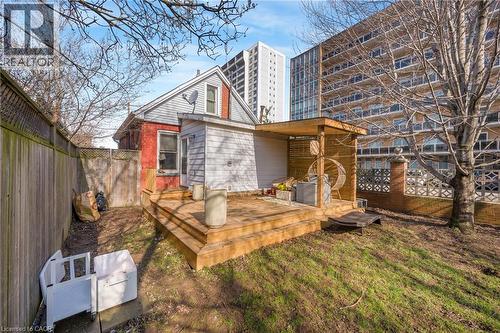 Back of house with a fenced backyard and a deck - 6 Ben Lomond Place, Hamilton, ON - Outdoor With Deck Patio Veranda