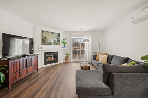 Salon - 202-351 Rue Du Clos-Toumalin, Prévost, QC - Indoor Photo Showing Living Room With Fireplace