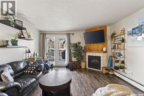 105H 1121 Mckercher Drive, Saskatoon, SK - Indoor Photo Showing Living Room With Fireplace