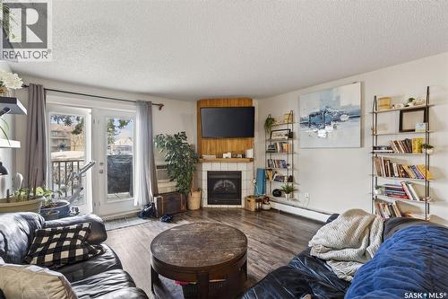 105H 1121 Mckercher Drive, Saskatoon, SK - Indoor Photo Showing Living Room With Fireplace