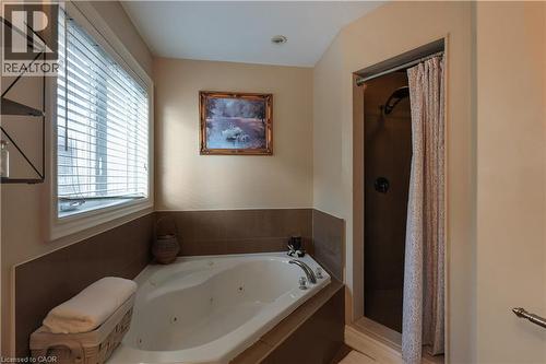 Bathroom featuring a stall shower and a whirlpool tub - 254 Rymal Road W, Hamilton, ON - Indoor Photo Showing Bathroom