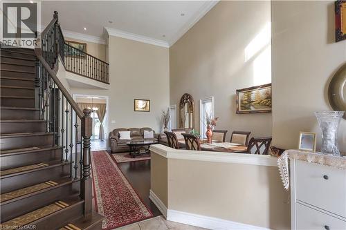 Living room with a high ceiling, healthy amount of natural light, crown molding, and light tile patterned flooring - 254 Rymal Road W, Hamilton, ON - Indoor Photo Showing Other Room