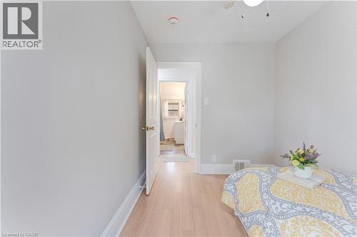 Bedroom featuring light wood finished floors and baseboards - 24 Onward Avenue, Kitchener, ON - Indoor Photo Showing Other Room