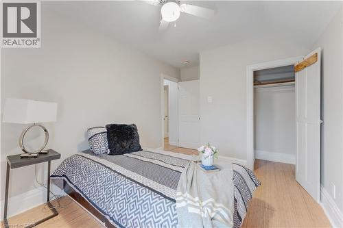Bedroom with light wood finished floors, a closet, and ceiling fan - 24 Onward Avenue, Kitchener, ON - Indoor Photo Showing Bedroom