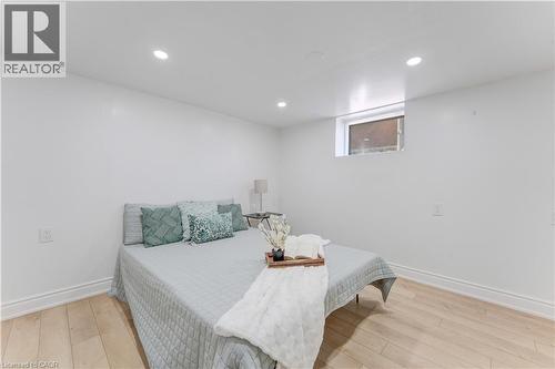 Bedroom featuring light wood-style flooring and recessed lighting - 24 Onward Avenue, Kitchener, ON - Indoor