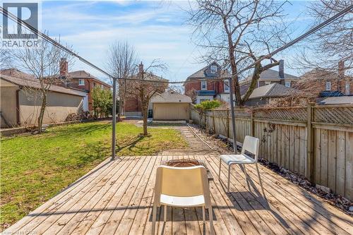 Wooden deck featuring a fenced backyard and an outbuilding - 24 Onward Avenue, Kitchener, ON - Outdoor With Deck Patio Veranda