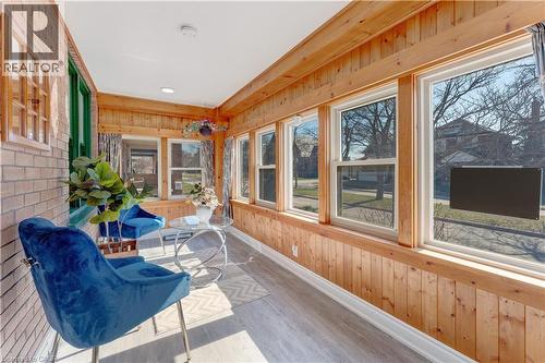Sunroom / solarium featuring wood walls and wood finished floors - 24 Onward Avenue, Kitchener, ON -  With Exterior