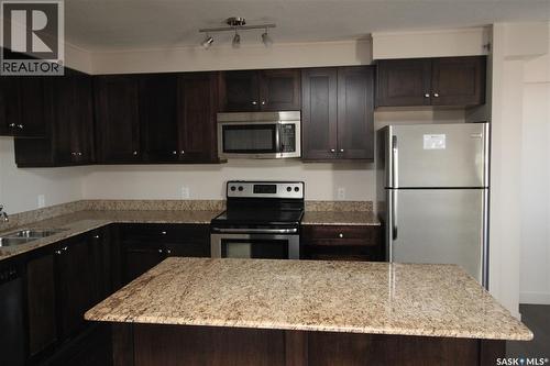 708 537 4Th Avenue N, Saskatoon, SK - Indoor Photo Showing Kitchen With Double Sink