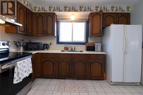 Kitchen featuring loads of cupboards - 1345 Colonsay Drive, Burlington, ON - Indoor Photo Showing Kitchen With Double Sink