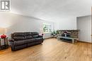 Bright living spaces with fireplace charm. - 876 Pinecrest Road, Ottawa, ON  - Indoor Photo Showing Living Room 