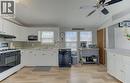Kitchen featuring black appliances, white cabinets, light countertops, lofted ceiling, and a ceiling fan - 580 Beaver Creek Road Unit# 185, Waterloo, ON  - Indoor Photo Showing Kitchen 
