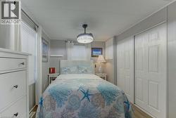 Bedroom with a closet and wood finished floors - 