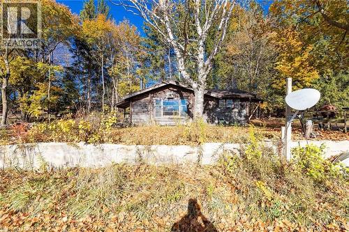 View of side of property featuring a view of trees - 6361 16Th Line, Minto, ON - Outdoor