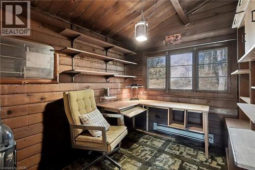 Sitting room featuring wooden ceiling and wood walls - 6361 16Th Line, Minto, ON - Indoor
