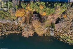 Aerial overview of property's location with a large body of water - 
