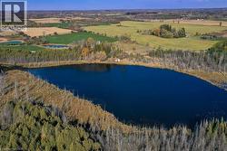 Aerial view of property and surrounding area with a nearby body of water - 