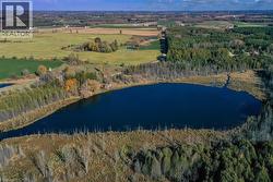 Aerial view of property's location with a large body of water and a forest - 
