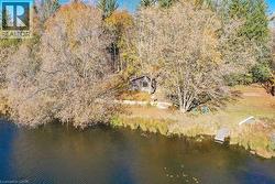 Aerial view of property and surrounding area featuring a large body of water - 
