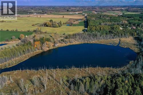 Aerial view of property's location with a large body of water and a forest - 6361 16Th Line, Minto, ON - Outdoor With View