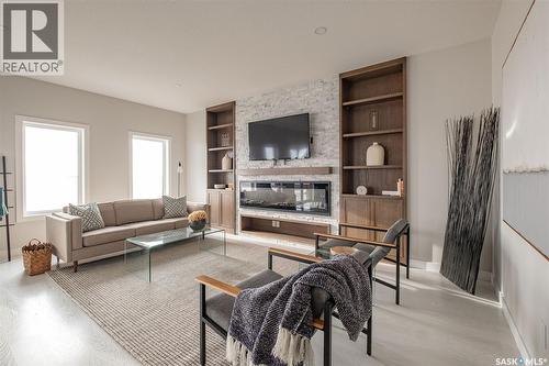 3748 Gee Crescent, Regina, SK - Indoor Photo Showing Living Room With Fireplace