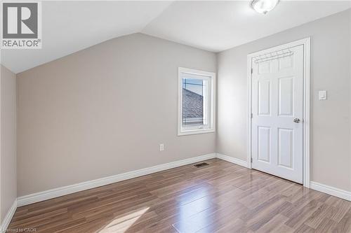 Bonus room with light wood-type flooring and vaulted ceiling - 20 East 27Th Street, Hamilton, ON - Indoor Photo Showing Other Room
