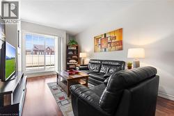 Living room with dark wood finished floors - 