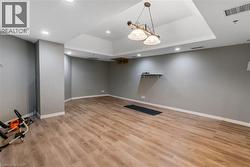Finished below grade yoga room featuring recessed lighting and light wood-style flooring - 