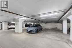 Garage featuring private owned space adjacent to elevator. - 