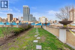 View of dog area with a view of city and a patio - 