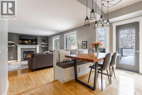922 Budz Green, Saskatoon, SK - Indoor Photo Showing Dining Room With Fireplace